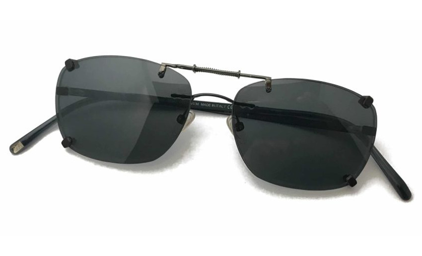Spring loaded clip on sunglasses over rimless eyeglasses